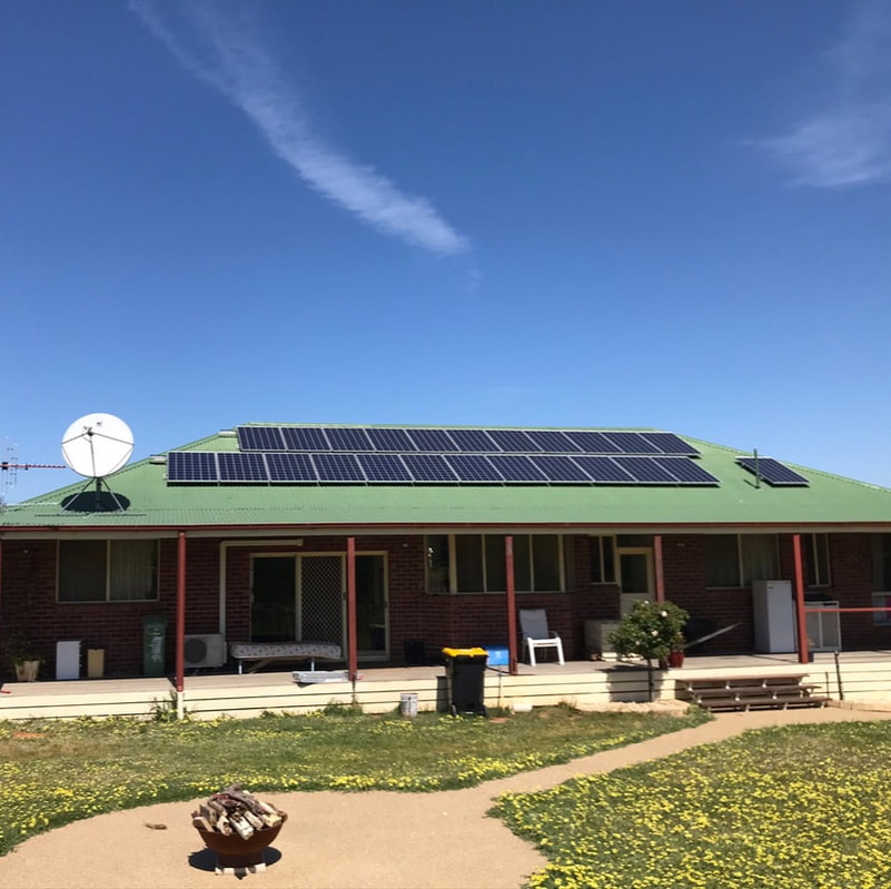Kennedy Electrical and Solar installers working on a roof